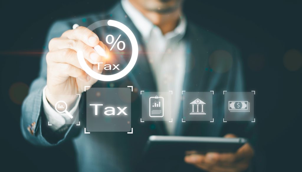 Businessman,Calculates,Tax,For,Individual,Income,Tax,Return,Form,Online